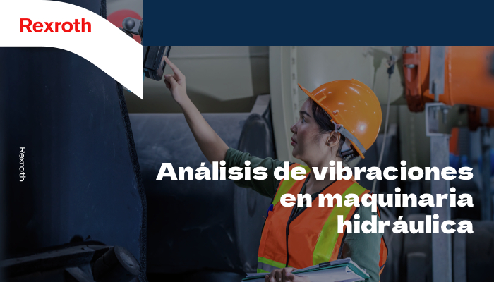 Una ingeniera realizando un análisis de vibraciones en una maquinaria